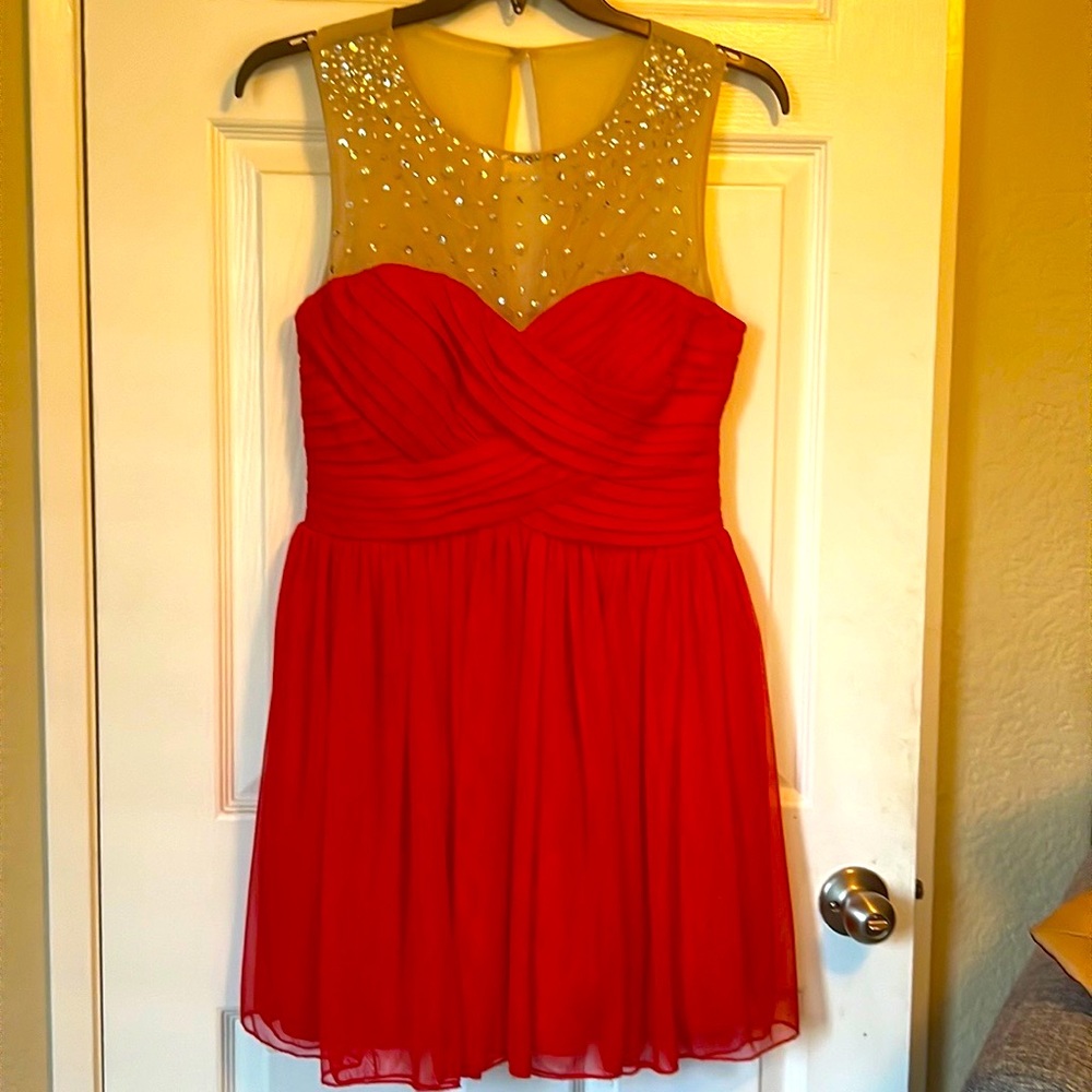 A Macy’s dress.  Never worn, Size 13 Junior.  Pearl Beaded Mesh.